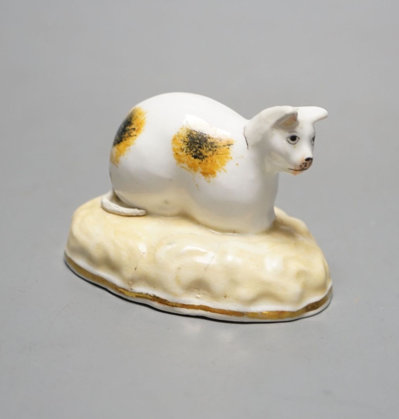 A rare Samuel Alcock porcelain model of a recumbent cat, circa 1835-50, impressed ‘6’, Cf. Dennis G. Rice, cats in English porcelain, colour plate 36., 7cms wide at base., Provenance: Dennis G. Rice collection.